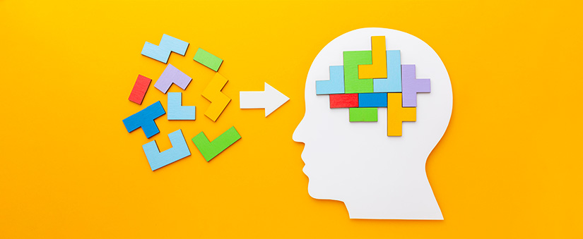 Inteligência emocional: ilustração do perfil de alguém com algumas peças coloridas no lugar do cérebro