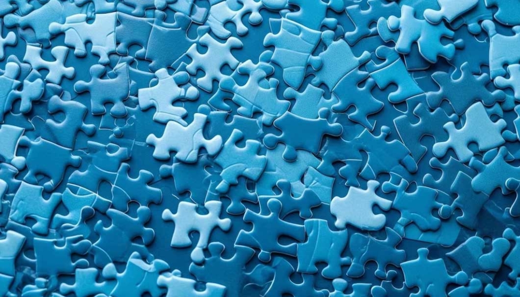 soluções para construtoras: imagem de várias peças de quebra-cabeça azuis.