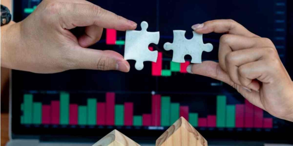 Indicadores imobiliários: imagem de duas mãos unindo duas peças de quebra-cabeças.