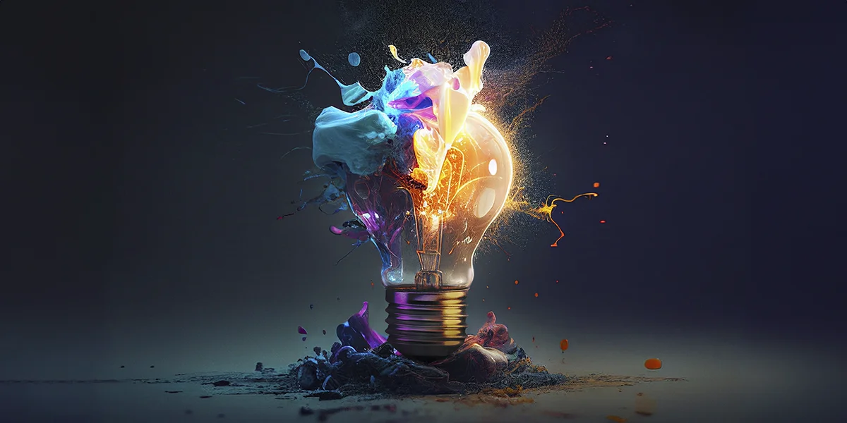 Marketing para construtoras: imagem de uma lâmpada quebrando. De dentro da lâmpada saem splashs de cores e luzes.