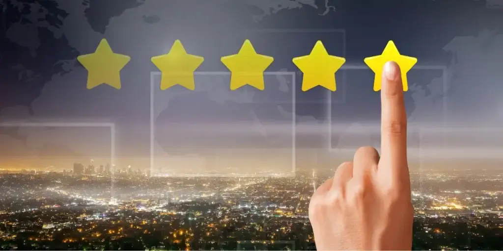 tendências do mercado imobiliário 2026 tendências do mercado imobiliário 2026: A composição visual mostra quatro estrelas amarelas em uma linha horizontal no topo da imagem, com uma mão apontando para a quarta estrela. No fundo, temos uma paisagem urbana noturna, com uma miríade de luzes que emanam dos edifícios e ruas da cidade.